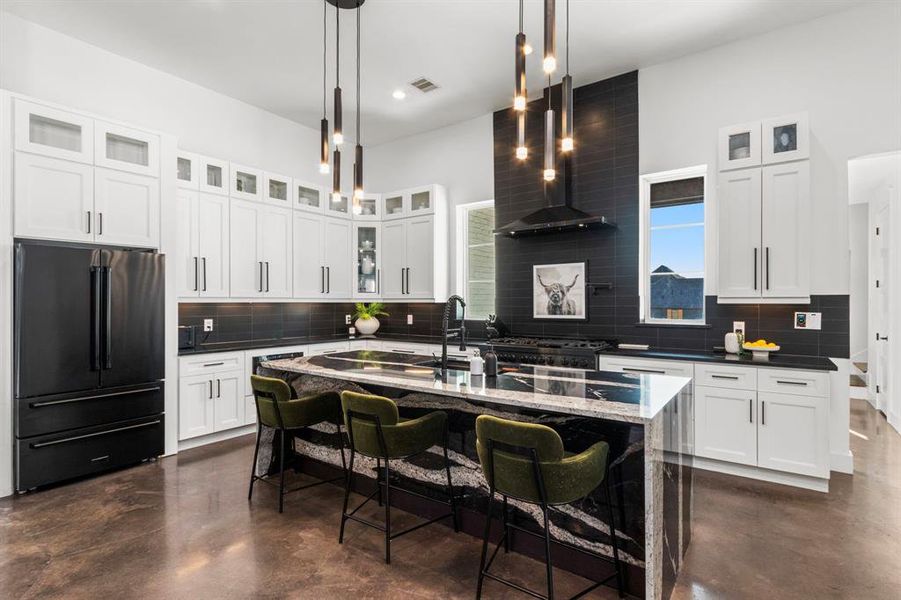 Your luxury kitchen is housed with an oversized island that is overflowing with custom granite. Every appliance is pieced by the ZLINE luxury edition.