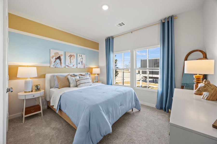 A bedroom with a bed and a window. A bedroom with a bed and a window.