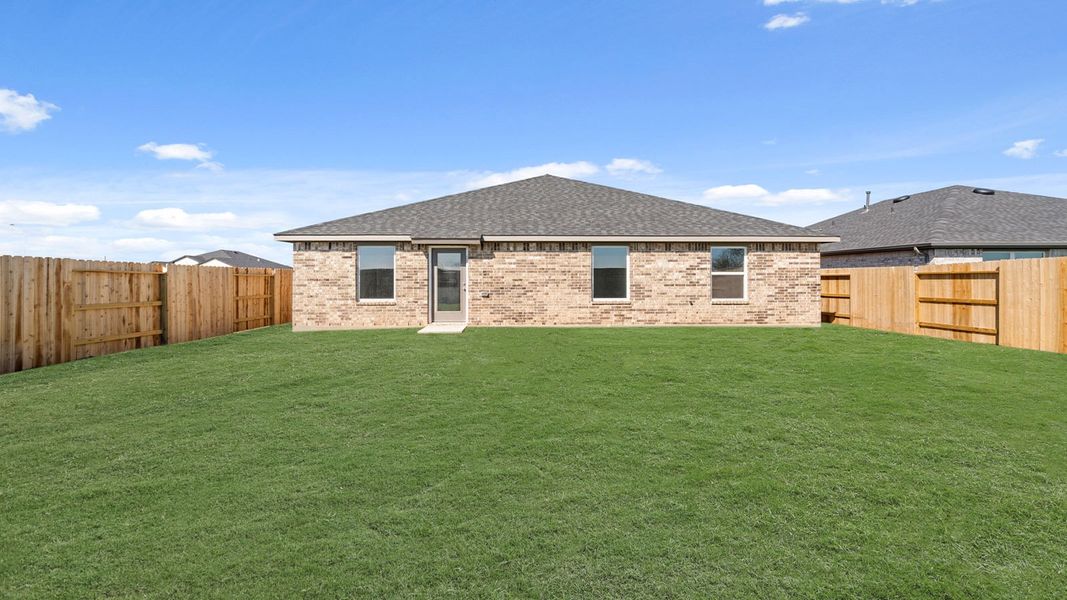 Exterior details and patio area of a home in Sunterra Lakes, Brookshire (Image 4).