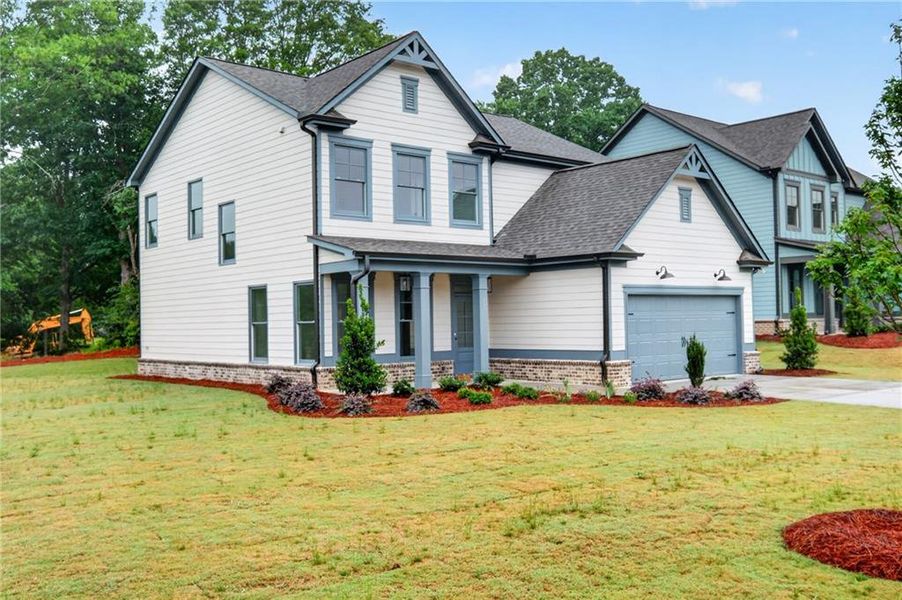Front exterior of a new home in , Winder, GA, highlighting curb appeal (Image 2). Front exterior of a new home in , Winder, GA, highlighting curb appeal (Image 2).