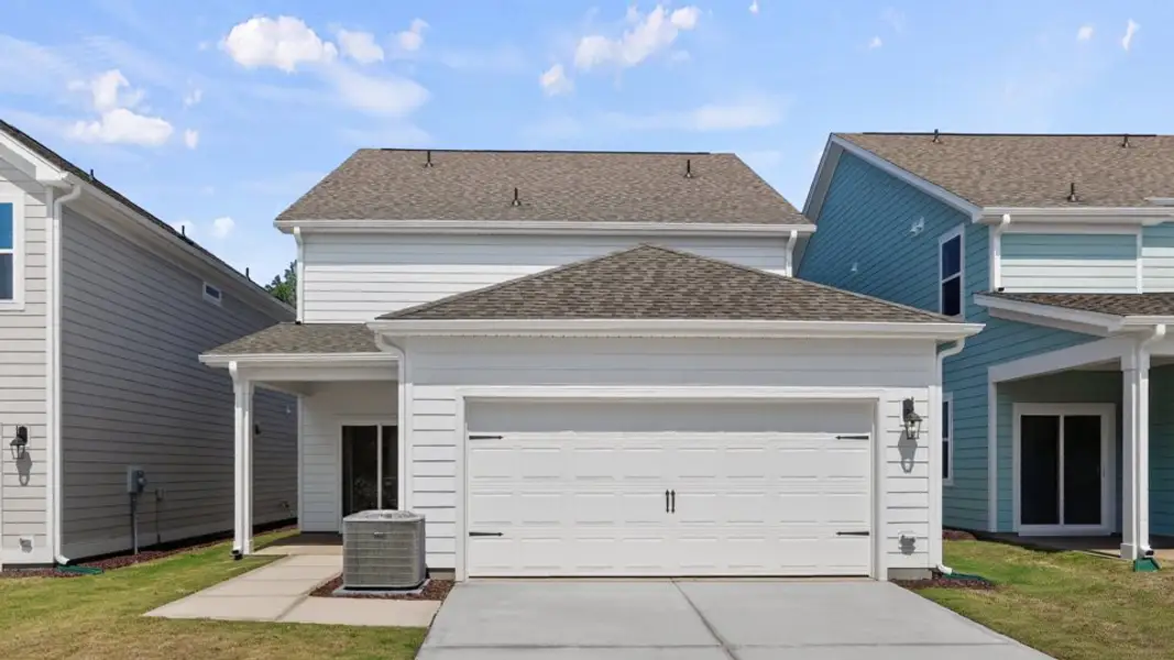 Front exterior of a new home in Madden West, Fuquay Varina, NC, highlighting curb appeal (Image 21).
