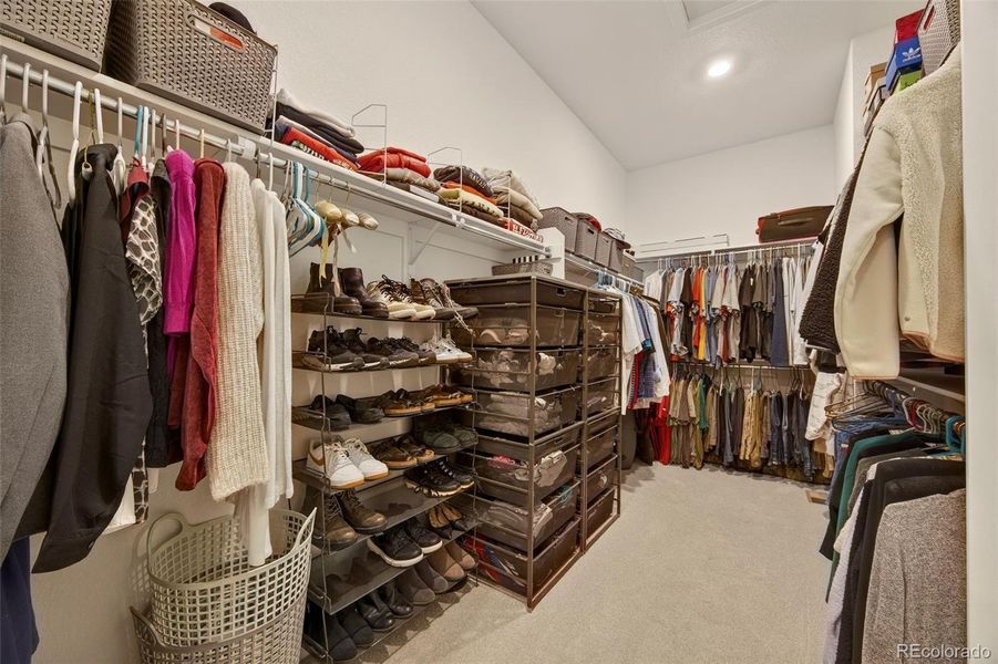 Primary closet with access to laundry room Primary closet with access to laundry room