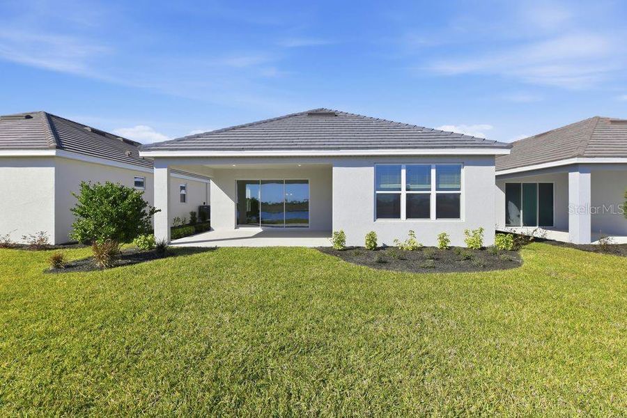 Exterior details and patio area of a home in Coasterra Community Group Page, Palmetto (Image 4).