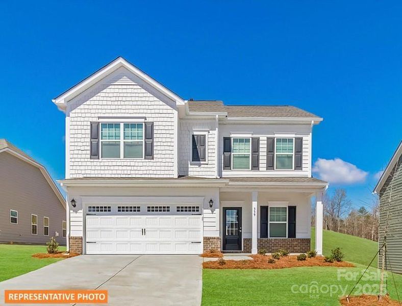 Front exterior of a new home in Green Acres, Concord, NC, highlighting curb appeal (Image 1).