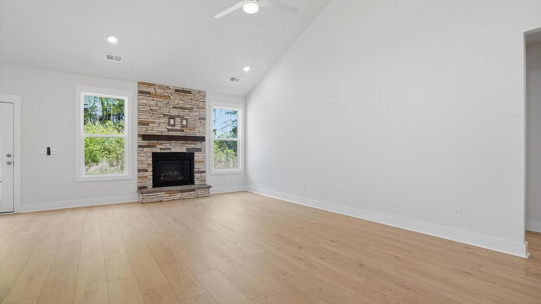 Highly skilled craftsmanship and modern elegance meet in this family room with soaring ceilings at Pelham Crossing
