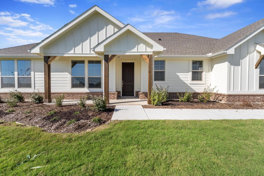 Front exterior of a new home in Clear Sky Addition, Valley View, TX, highlighting curb appeal (Image 24). Front exterior of a new home in Clear Sky Addition, Valley View, TX, highlighting curb appeal (Image 24).