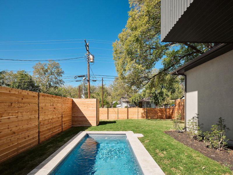View of pool with a fenced backyard