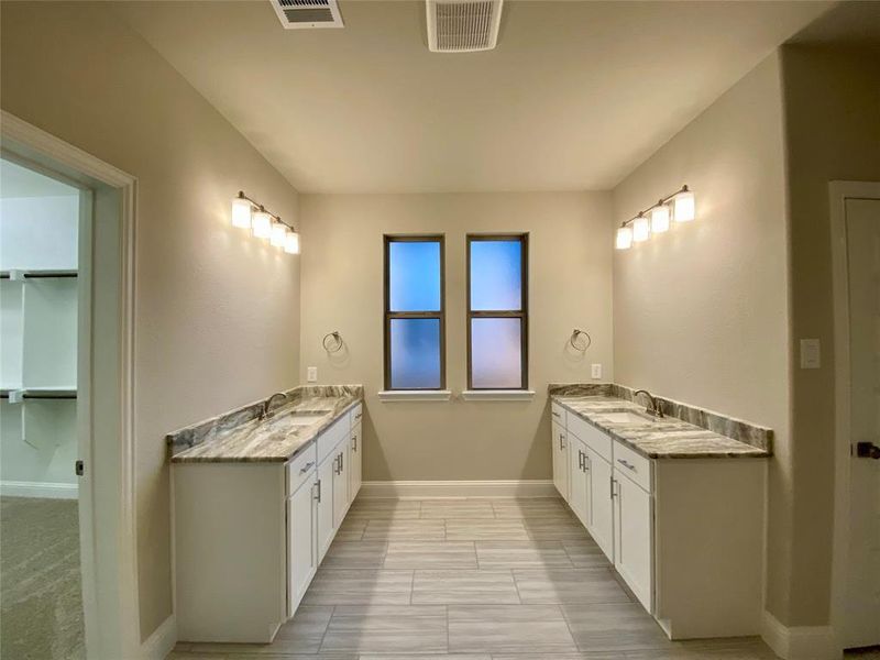 Separate vanities (actual home has white Monet Quartz counters w/ grey vain.)