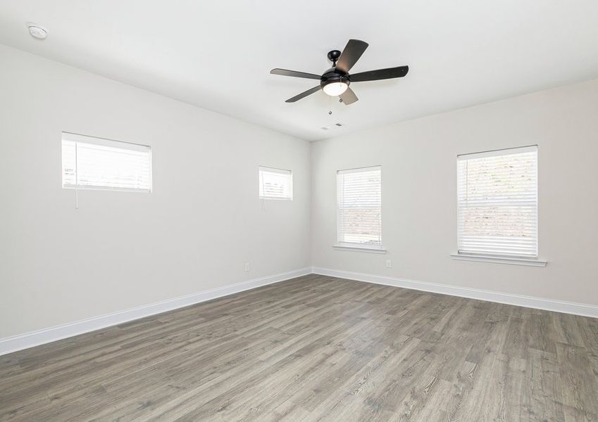 Rest and relaxation await in the master bedroom