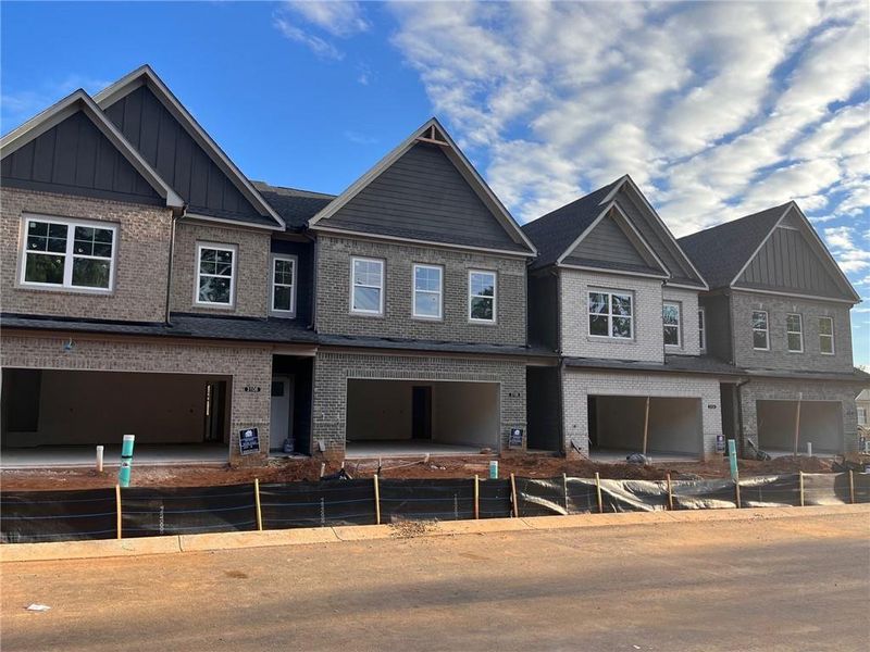Front exterior of a new home in Governors Parc, Kennesaw, GA, highlighting curb appeal (Image 20). Front exterior of a new home in Governors Parc, Kennesaw, GA, highlighting curb appeal (Image 20).