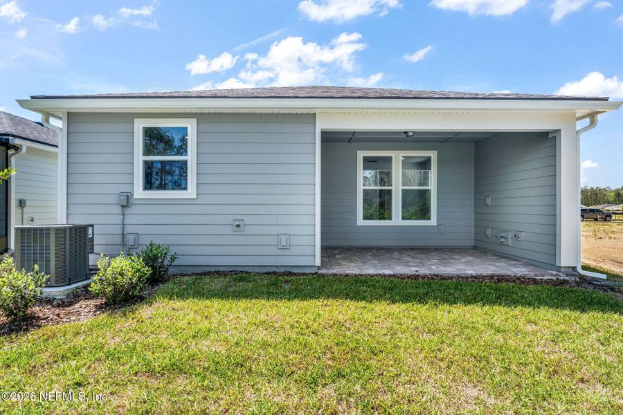 Exterior details and patio area of a home in Del Webb Wildlight, Yulee (Image 28).