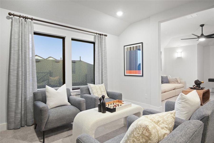 Carpeted game room with a ceiling fan, lofted ceiling, and recessed lighting