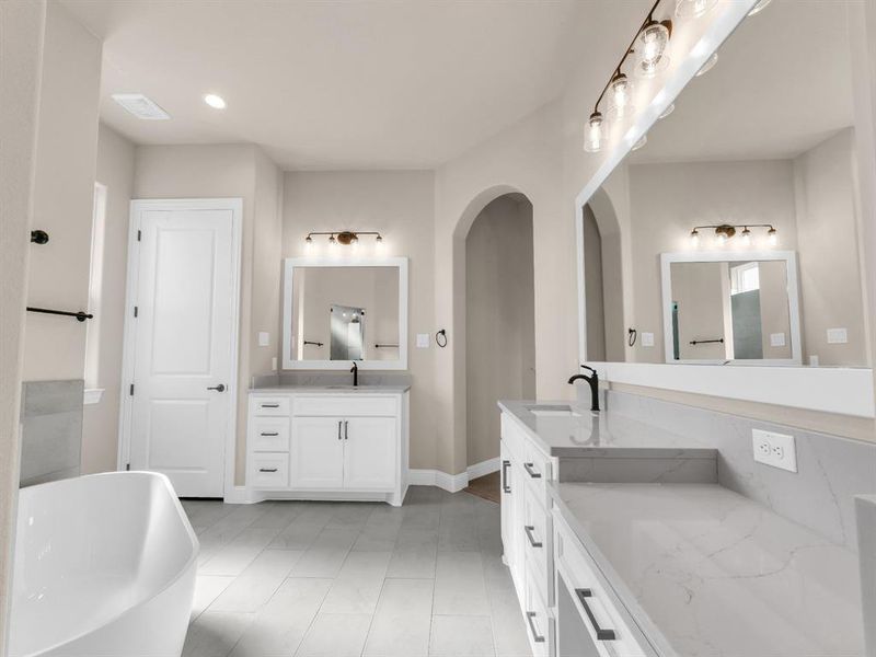 Bathroom with a bathtub and vanity