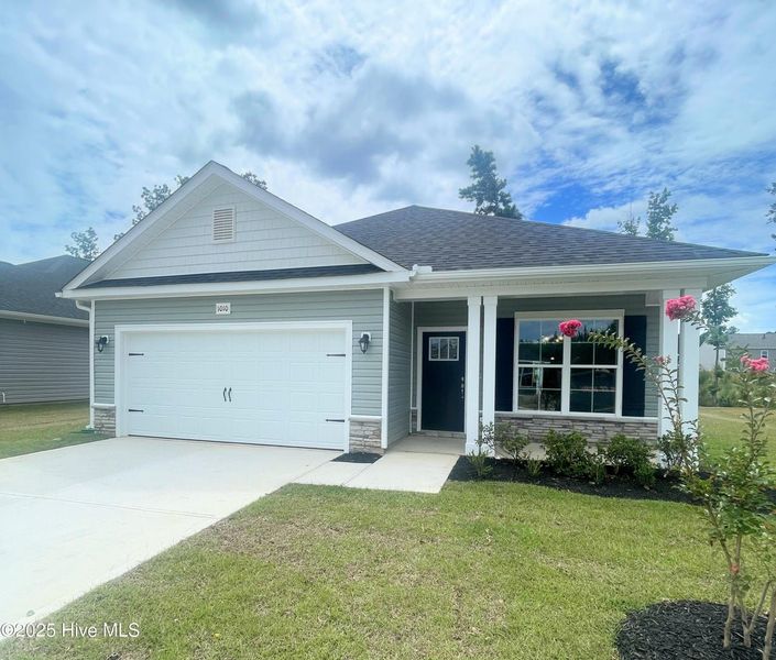 Front exterior of a new home in Athens Acres, New Bern, NC, highlighting curb appeal (Image 1).
