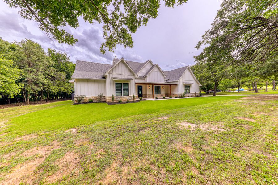 Representative exterior photo of a completed home built from the Ashley by Zeal Home Builders in Echo Grove, Poolville, TX (Image 2). Representative exterior photo of a completed home built from the Ashley by Zeal Home Builders in Echo Grove, Poolville, TX (Image 2).