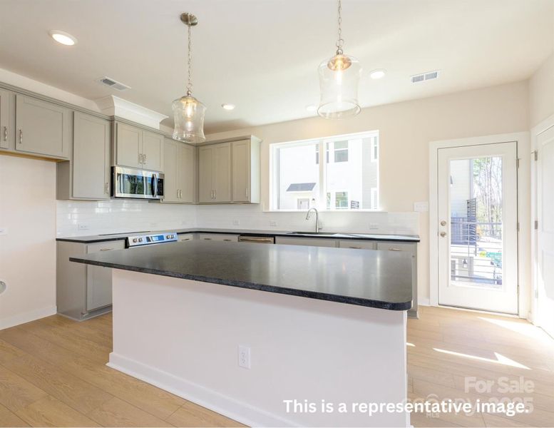 Furnished interior view inside a new home in Central Living at Craig, Charlotte (Image 6).