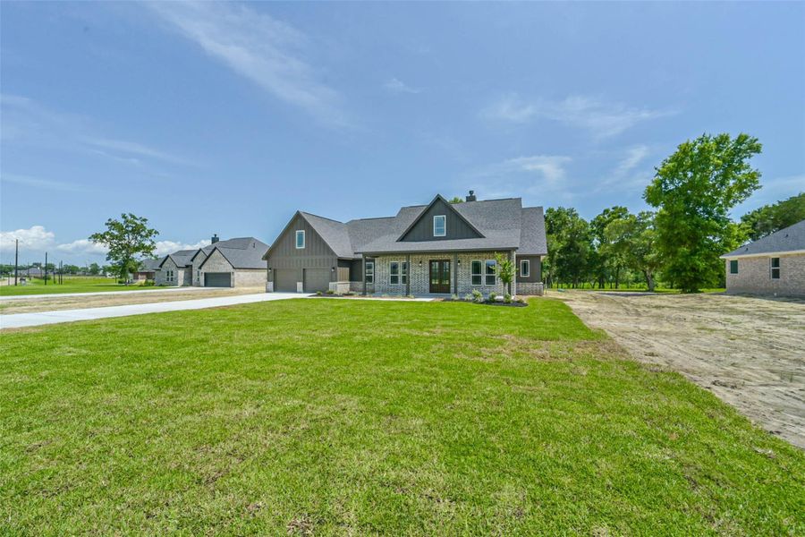 Front exterior of a new home in , Baytown, TX, highlighting curb appeal (Image 26).