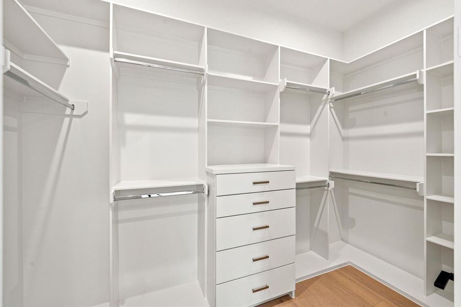 One of two closets for the primary bedroom.