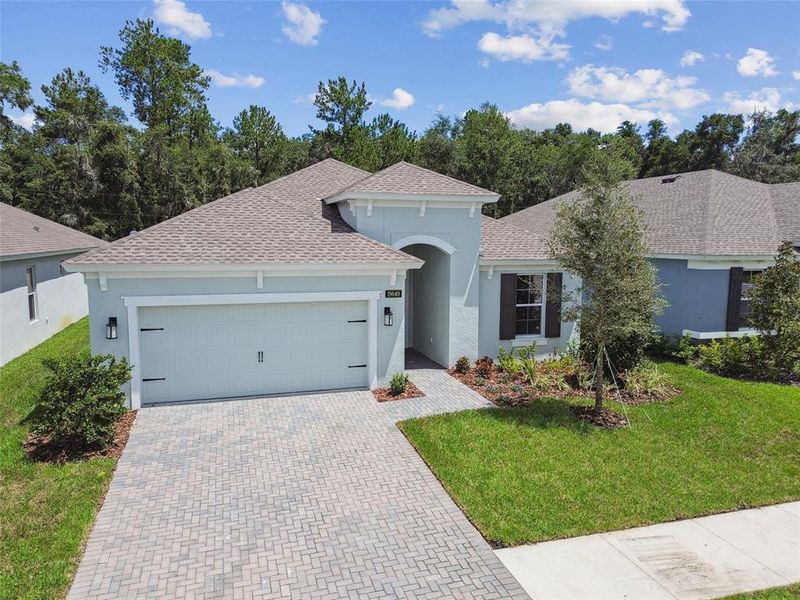 Front exterior of a new home in Cascades at Southern Hills, Brooksville, FL, highlighting curb appeal (Image 32).