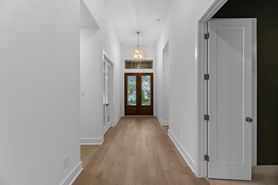 This stunning view features the double door entry, private home office to the left, and entry doors to the entertainment/media room! This stunning view features the double door entry, private home office to the left, and entry doors to the entertainment/media room!