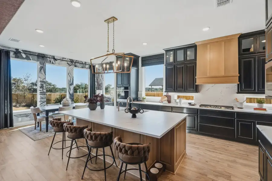 Representative furnished interior of a home built from the Rivers by Chesmar Homes in Prominence 50's, San Antonio (Image 5).