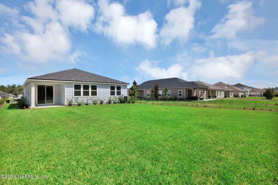 Front exterior of a new home in Hyland Trail, Green Cove Springs, FL, highlighting curb appeal (Image 16).