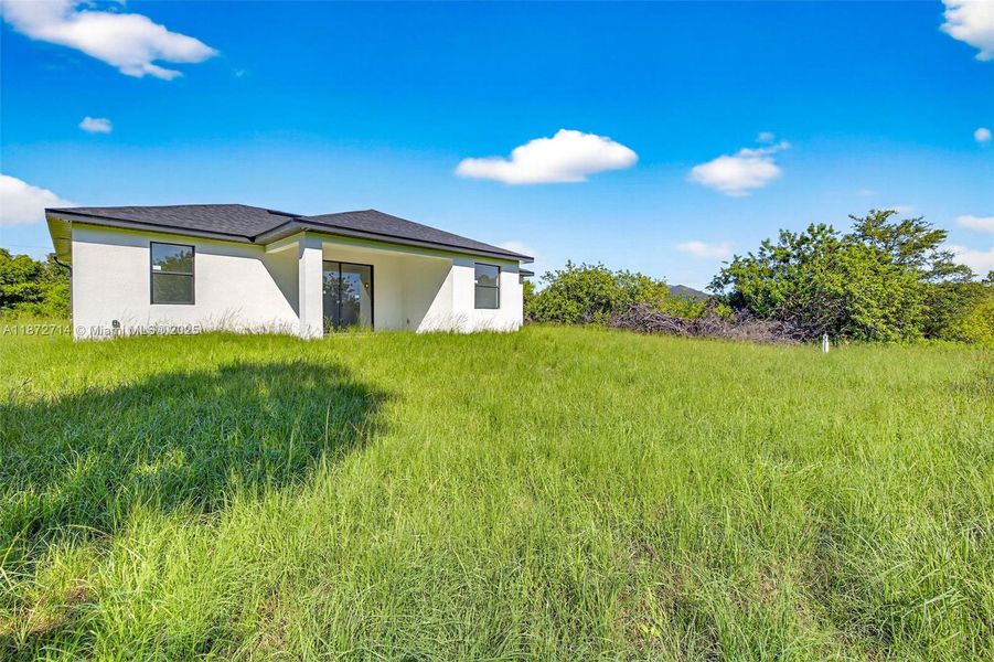 Front exterior of a new home in , Lehigh Acres, FL, highlighting curb appeal (Image 17). Front exterior of a new home in , Lehigh Acres, FL, highlighting curb appeal (Image 17).