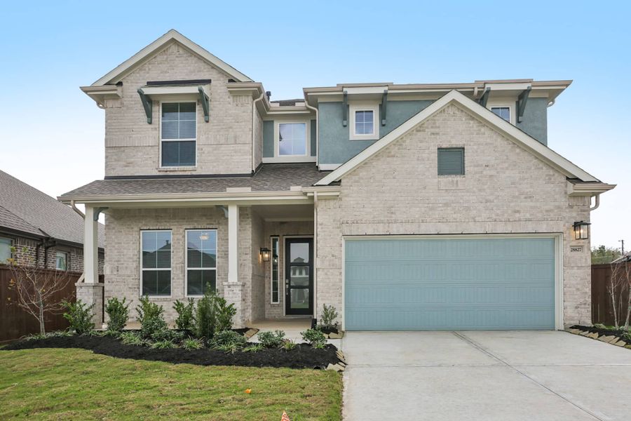 Representative exterior photo of a completed home built from the MacAlister by Chesmar Homes in The Trails, New Caney, TX (Image 16). Representative exterior photo of a completed home built from the MacAlister by Chesmar Homes in The Trails, New Caney, TX (Image 16).