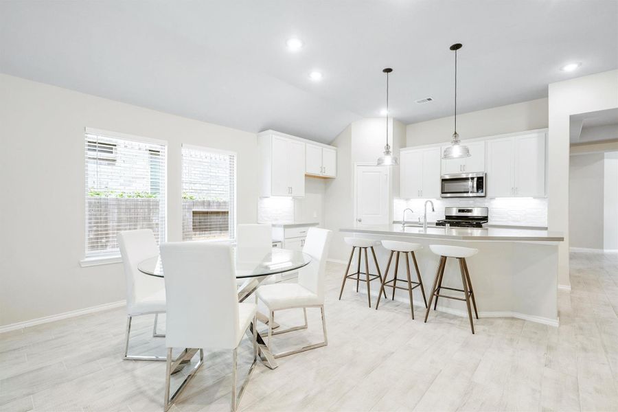 Dining and cooking in perfect harmony. The casual dining area flows directly into the kitchen. This layout was made for people who love to gather. Dining and cooking in perfect harmony. The casual dining area flows directly into the kitchen. This layout was made for people who love to gather.