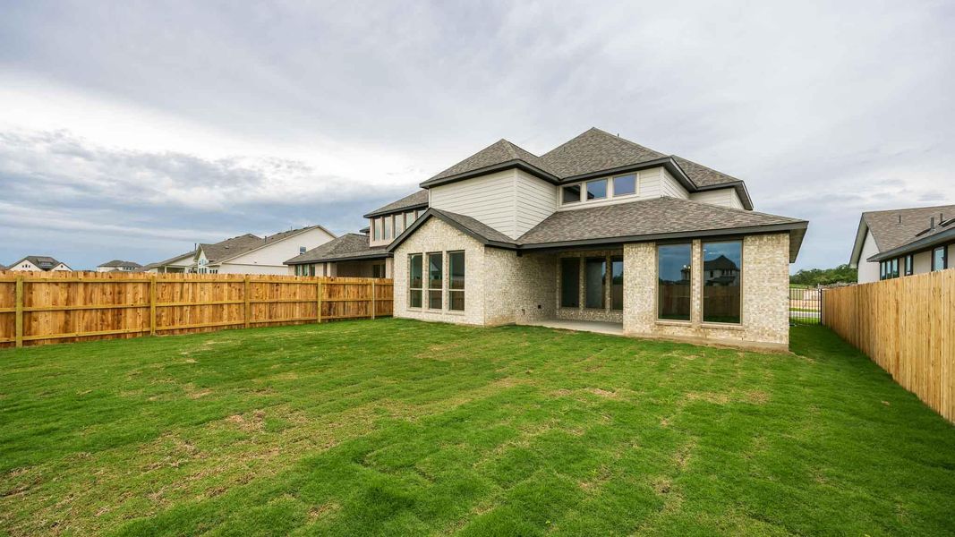 Exterior details and patio area of a home in Santa Rita Ranch - Tierra Rosa, Liberty Hill (Image 3).