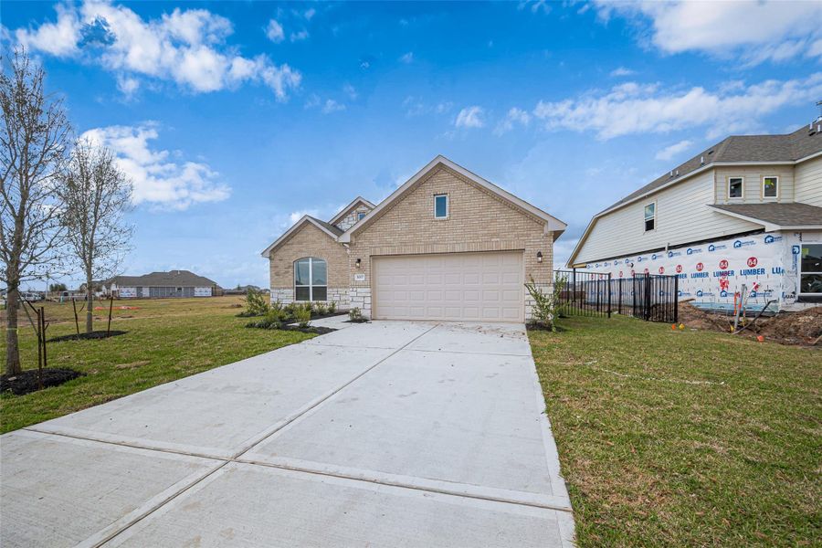 Front exterior of a new home in Lago Mar, Texas City, TX, highlighting curb appeal (Image 29).