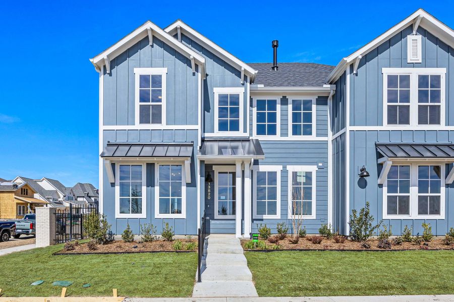 Front exterior of a new home in Fields, Frisco, TX, highlighting curb appeal (Image 27). Front exterior of a new home in Fields, Frisco, TX, highlighting curb appeal (Image 27).