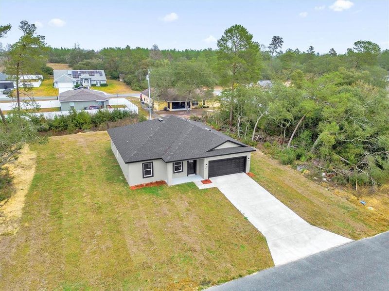 Front exterior of a new home in , Ocala, FL, highlighting curb appeal (Image 20).