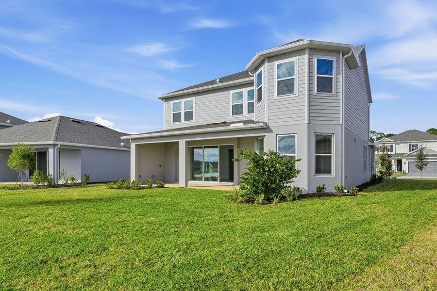 Exterior details and patio area of a home in Ardisia Park, New Smyrna Beach (Image 23).
