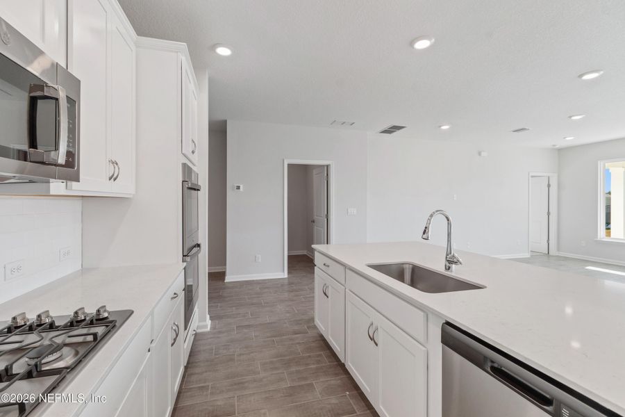 Furnished interior view inside a new home in Tributary 50', Yulee (Image 7).