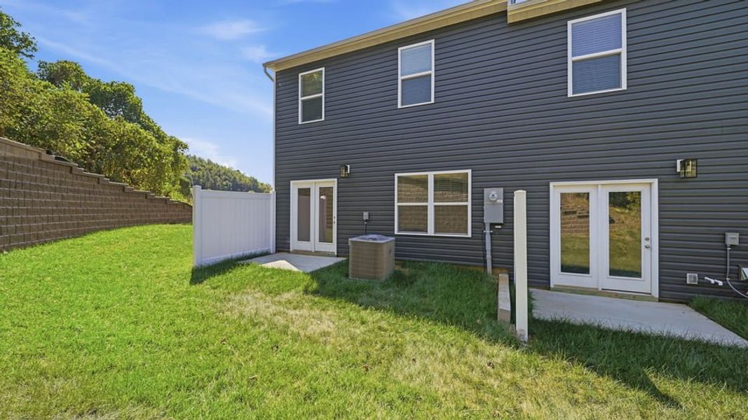 Exterior details and patio area of a home in The Arbor Townhomes, Kingsport (Image 3).