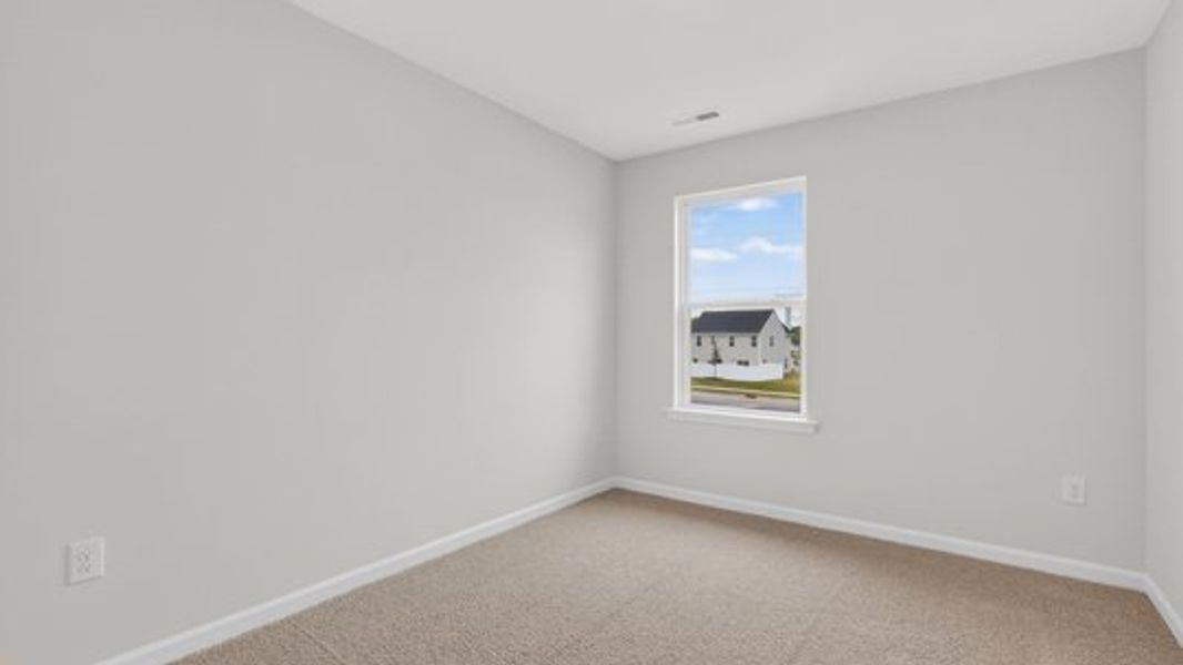 Spacious, unfurnished interior of a new home in The Townes at Belle Grove, Wendell (Image 16).