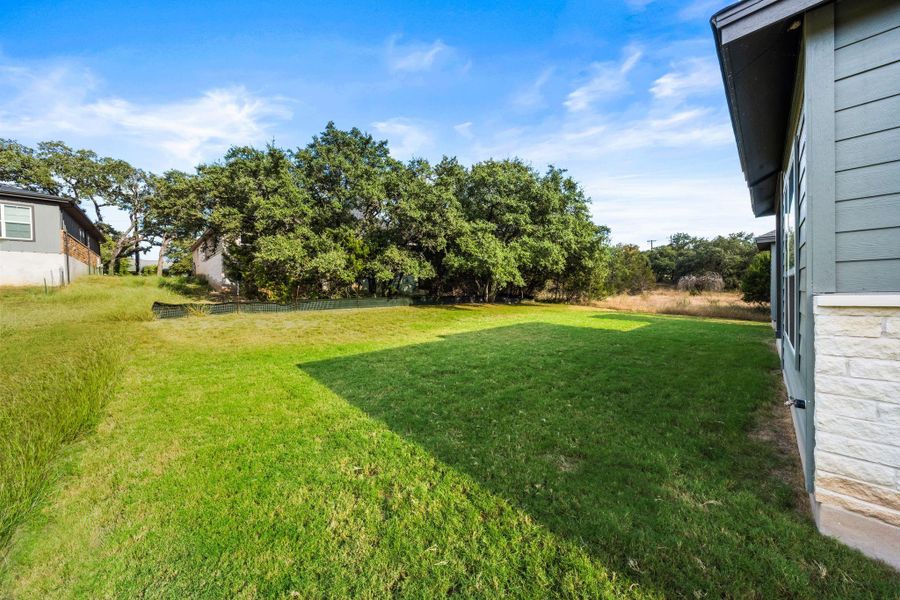 Front exterior of a new home in , Spicewood, TX, highlighting curb appeal (Image 25). Front exterior of a new home in , Spicewood, TX, highlighting curb appeal (Image 25).