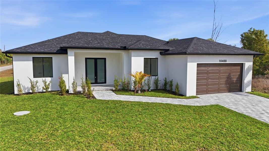 Front exterior of a new home in , Port Charlotte, FL, highlighting curb appeal (Image 20).