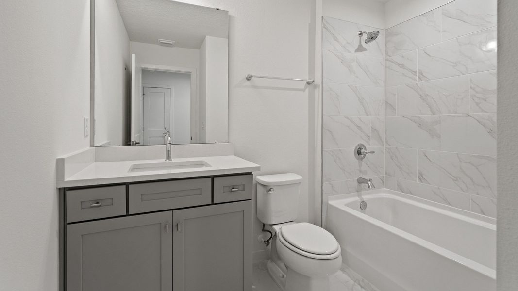 Second Bathroom in the Mandarin by DRB Homes in Trinity Place located in St. Cloud, FL Second Bathroom in the Mandarin by DRB Homes in Trinity Place located in St. Cloud, FL