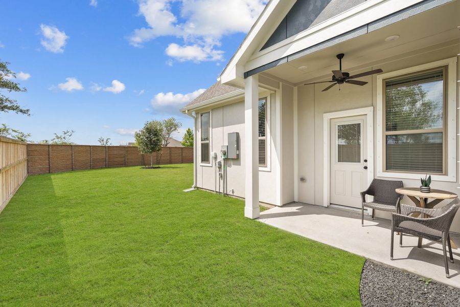 Exterior details and patio area of a home in Bridgeland, Cypress (Image 35).