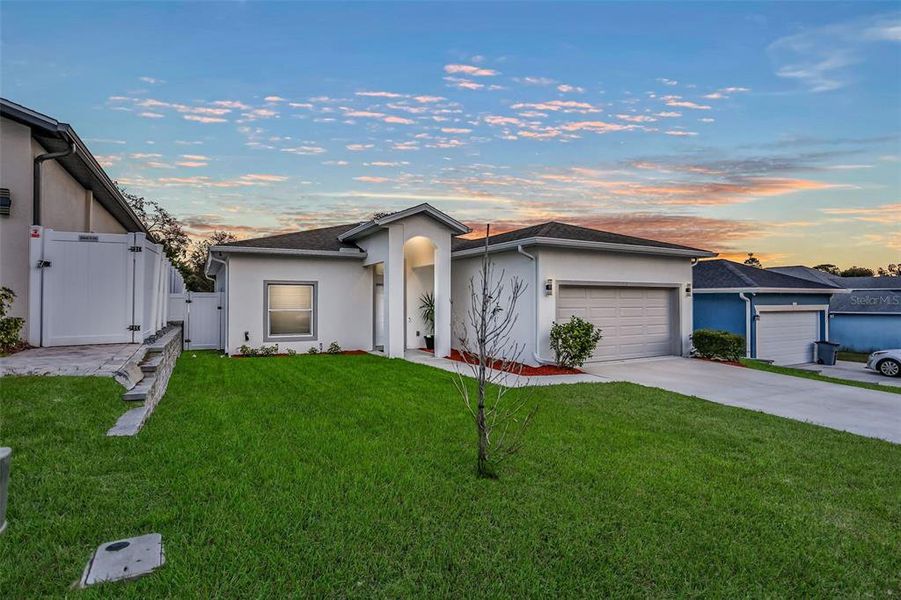Front exterior of a new home in , New Port Richey, FL, highlighting curb appeal (Image 25).