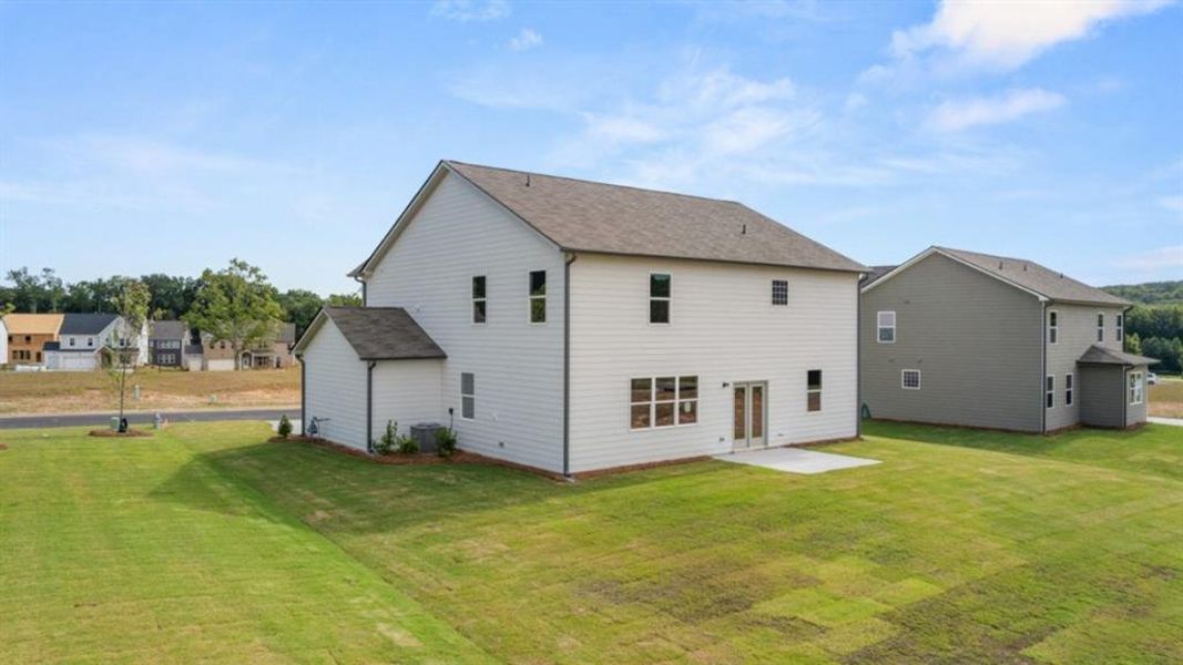 Exterior details and patio area of a home in Fairway 17 at Mirror Lake, Villa Rica (Image 22).