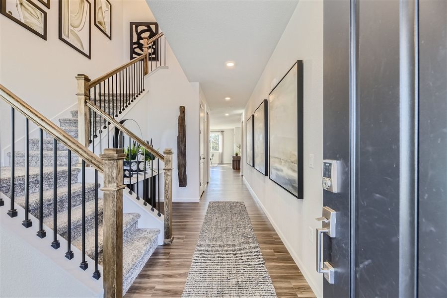 A hallway with white walls.