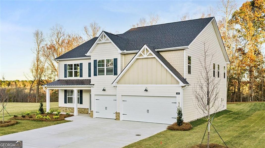 Front exterior of a new home in Heritage Pointe, Senoia, GA, highlighting curb appeal (Image 2). Front exterior of a new home in Heritage Pointe, Senoia, GA, highlighting curb appeal (Image 2).