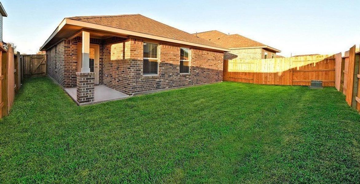 Front exterior of a new home in Bayou Maison, Dickinson, TX, highlighting curb appeal (Image 2).
