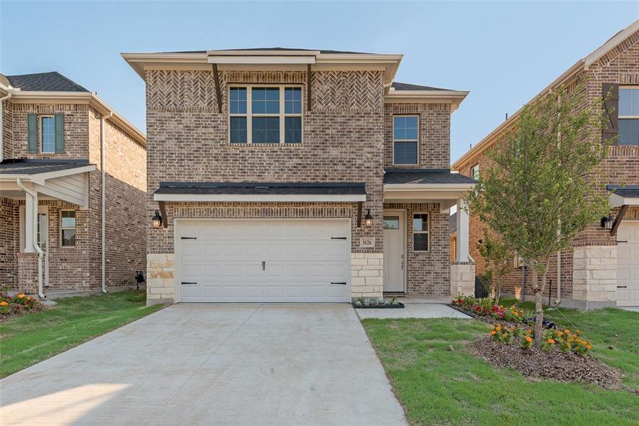 Front exterior of a new home in Walden Pond, Forney, TX, highlighting curb appeal (Image 20). Front exterior of a new home in Walden Pond, Forney, TX, highlighting curb appeal (Image 20).