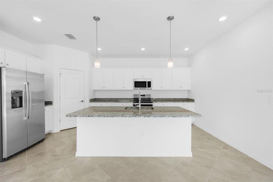 Furnished interior view inside a new home in Hampton Lakes at River Hall, Alva (Image 8).