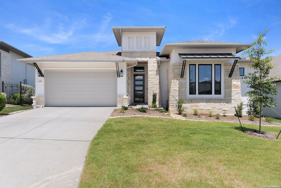 Front exterior of a new home in El Sonido at Campanas, San Antonio, TX, highlighting curb appeal (Image 28). Front exterior of a new home in El Sonido at Campanas, San Antonio, TX, highlighting curb appeal (Image 28).