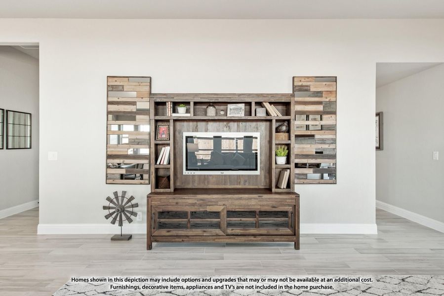 Rustic wood entertainment center with built-in shelving and TV mount in an open living area with light tile floors